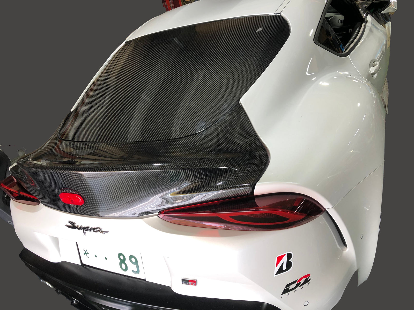 REVOLUTION REAR CARBON SMOOTHING GATE FOR TOYOTA SUPRA A90 A90-RCSG