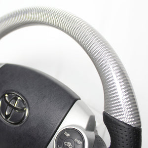 REAL PREMIUM SERIES OVAL SHAPE SILVER CARBON GLOSSY BLUE X SILVER EURO STITCH STEERING WHEEL FOR TOYOTA AQUA NHP10  30-BST-SLC