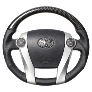 REAL PREMIUM SERIES OVAL SHAPE BLACK CARBON BLUE X SILVER EURO STITCH STEERING WHEEL FOR TOYOTA AQUA NHP10  30-BS-BKC