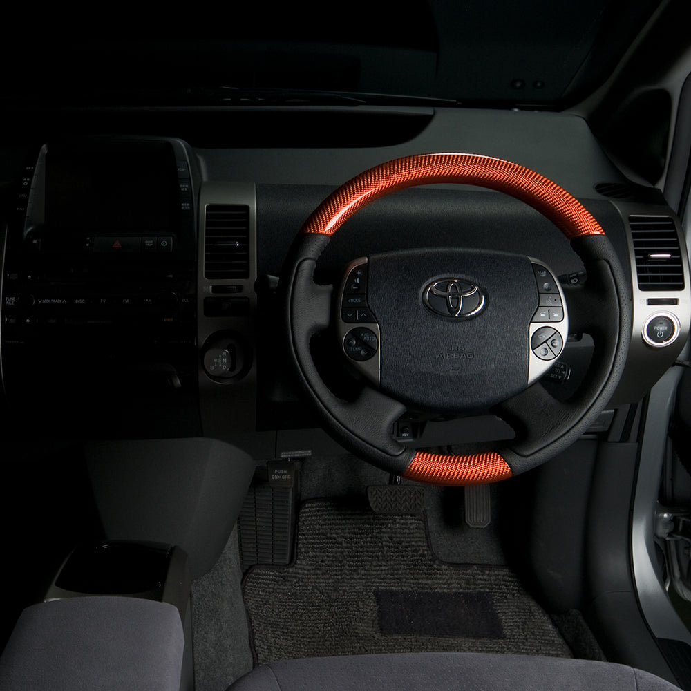REAL ORIGINAL SERIES OVAL SHAPE ORANGE CARBON BLACK STITCH STEERING WHEEL FOR TOYOTA PRIUS EX 20  20-1-ORC