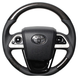 REAL PREMIUM SERIES SET BLACK CARBON STEERING + PIANO BLACK UNDER PAD BLACK EURO STITCH STEERING WHEEL FOR TOYOTA PRIUS 50  50P-BKC-BK-PBP