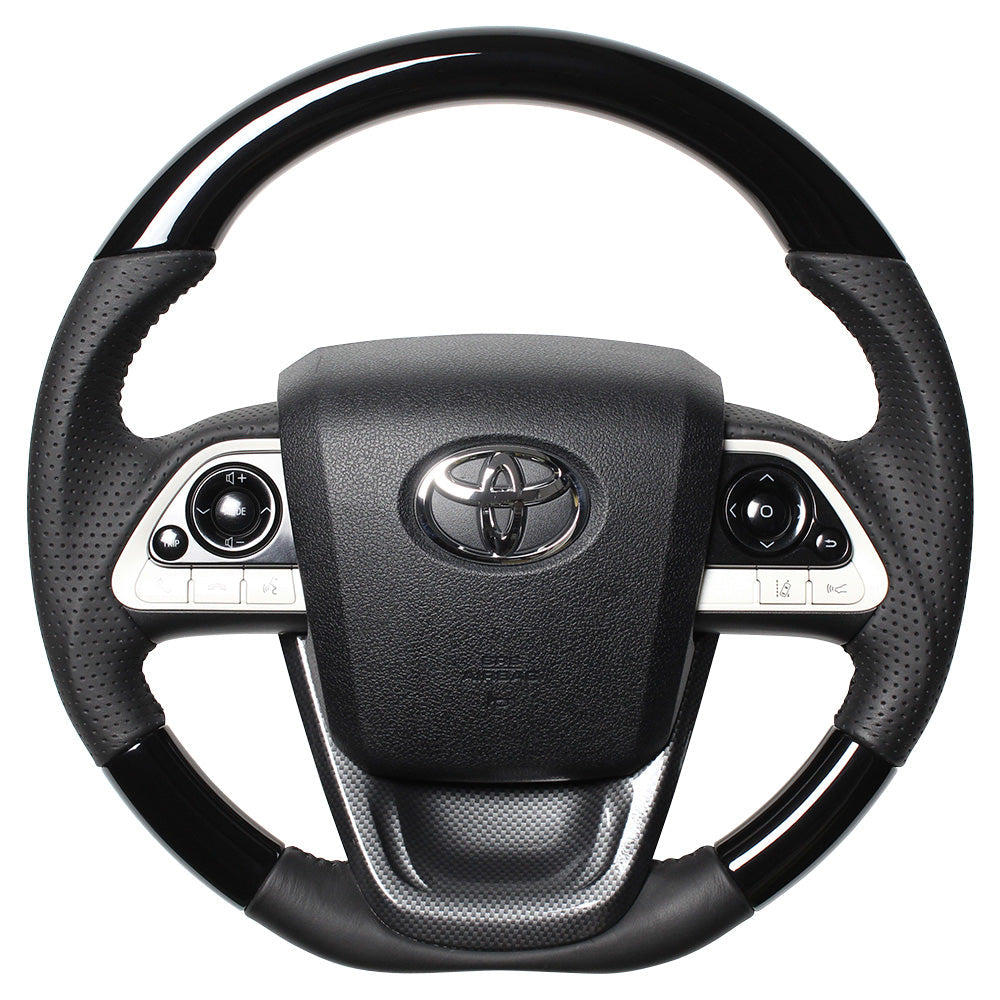 REAL ORIGINAL SERIES SET PIANO BLACK STEERING + BLACK CARBON PRINT UNDER PAD BLACK STITCH STEERING WHEEL FOR TOYOTA PRIUS 50  50-PBW-BK-BKT