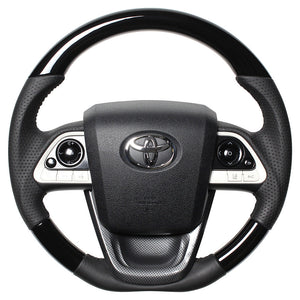REAL ORIGINAL SERIES SET PIANO BLACK STEERING + BLACK CARBON PRINT UNDER PAD BLACK STITCH STEERING WHEEL FOR TOYOTA PRIUS 50  50-PBW-BK-BKT