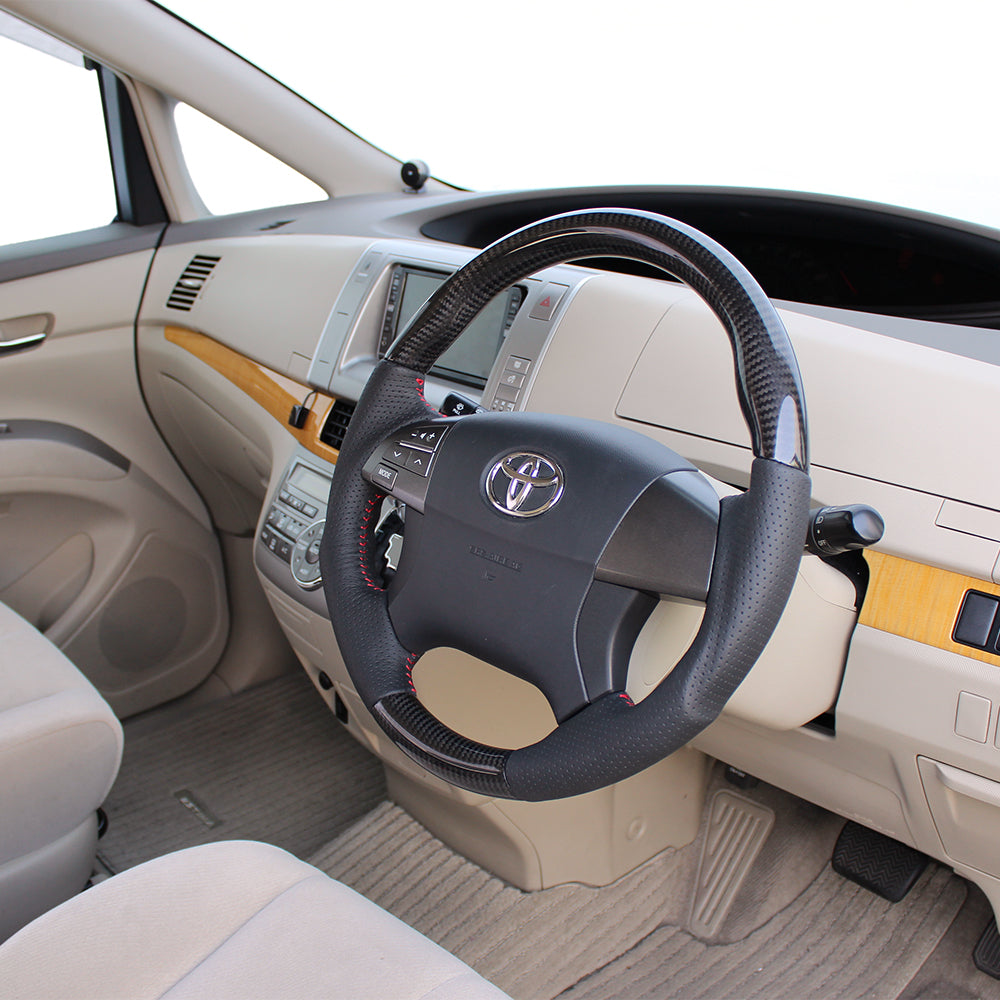 REAL ORIGINAL SERIES ROUND SHAPE BLACK CARBON RED STITCH STEERING WHEEL FOR TOYOTA ESTIMA HYBRID AHR20W:1-3 TYPE  R50-BKC-RD