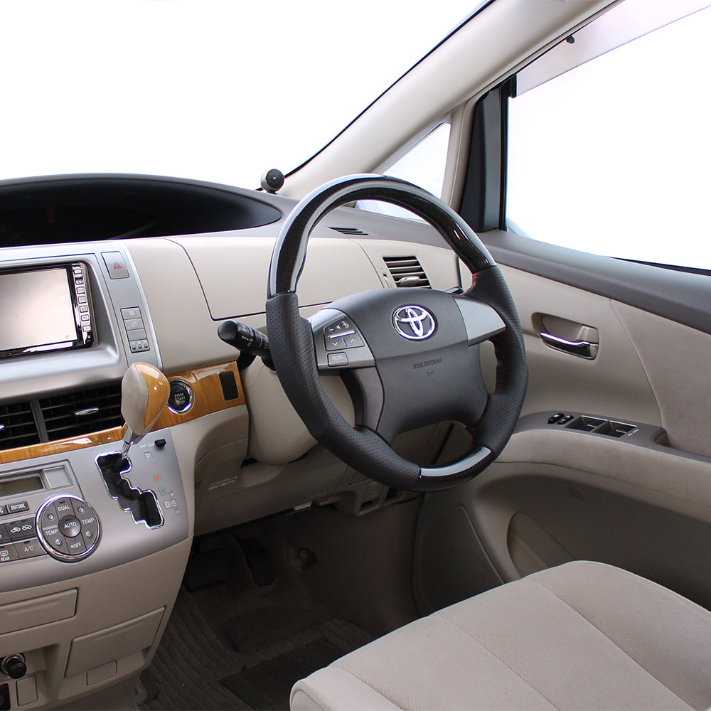 REAL ORIGINAL SERIES ROUND SHAPE BLACK CARBON RED STITCH STEERING WHEEL FOR TOYOTA ESTIMA 50 : 1-3 TYPES  R50-BKC-RD
