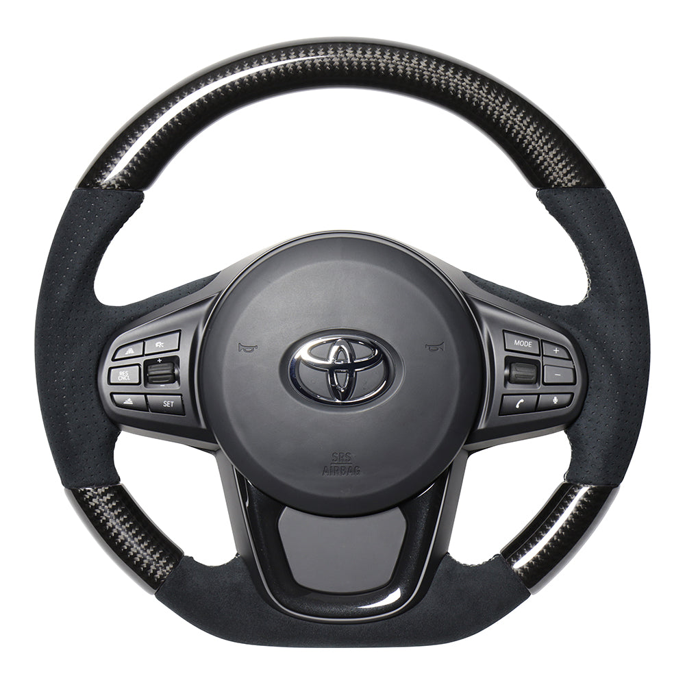 REAL PREMIUM SERIES D SHAPE BLACK CARBON & BLACK ULTRA SUEDE SILVER EURO STITCH STEERING WHEEL FOR TOYOTA SUPRA DB TYPE  TYCP-ALC-BKC
