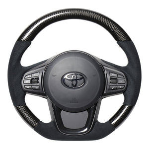 REAL PREMIUM SERIES D SHAPE BLACK CARBON & BLACK ULTRA SUEDE SILVER EURO STITCH STEERING WHEEL FOR TOYOTA SUPRA DB TYPE  TYCP-ALC-BKC