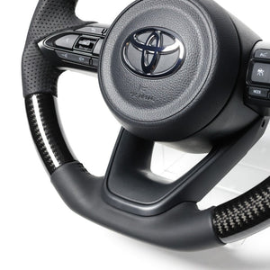 REAL ORIGINAL SERIES D SHAPE BLACK CARBON BLACK STITCH STEERING WHEEL FOR TOYOTA AQUA GR SPORT MXPK11  TYJ-BKC