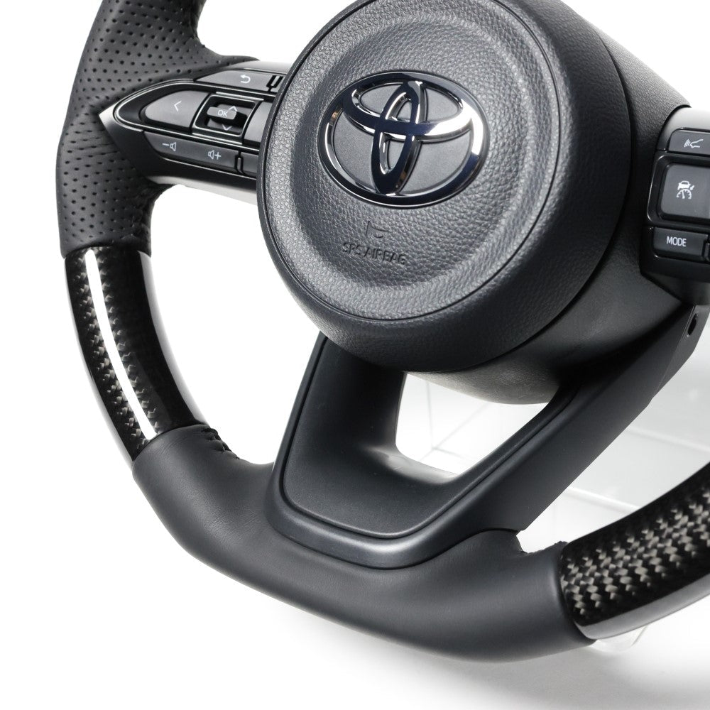 REAL ORIGINAL SERIES D SHAPE BLACK CARBON BLACK STITCH STEERING WHEEL FOR TOYOTA YARIS CROSS GR SPORT MXPJ10 MXPB10  TYJ-BKC
