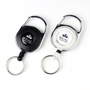 REAL REEL KEYCHAIN WITH REAL LOGO SMALL WHITE REAL-REEL-WH