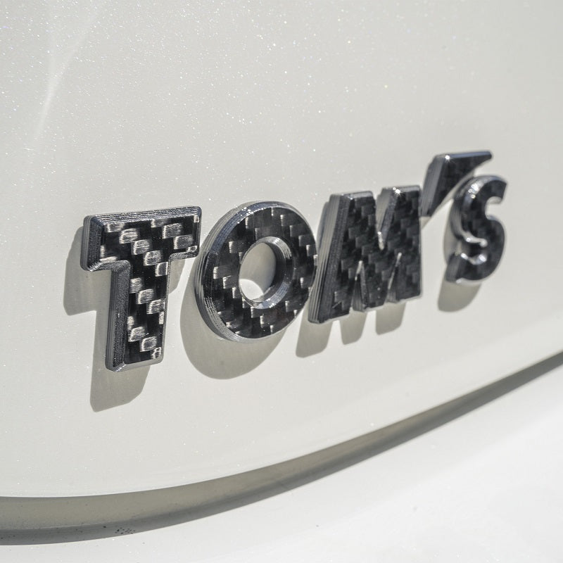 TOMS CARBON EMBLEM GLOSS FOR  08233-TS004