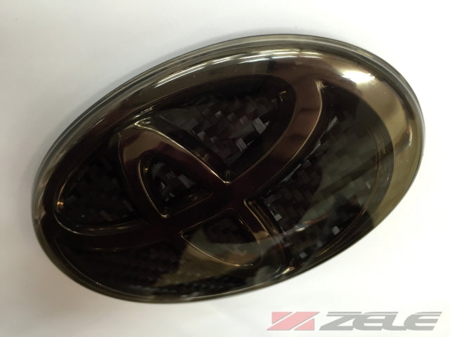 ZELE CARBON HYBRID EMBLEM COVER FRONT BLUE SMOKE SILVER FOR TOYOTA 86 ZN6 ZENKI ZELE-00037